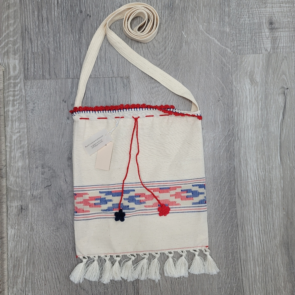 Boho fabric crossbody bag with knit string and flowers and fringe. 10"×9" - Picture 7 of 8